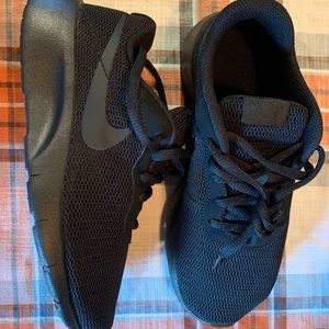 Brand new. Never used. Original box. Nike Tanjun all black Youth US Size 3.5 .